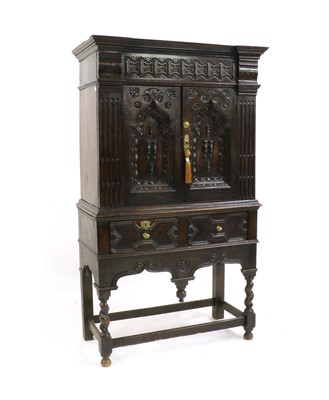 Lot 510 - A 'Jacobean' oak cupboard
