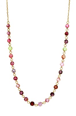 Lot 64 - A gold gemstone necklace, c.1910