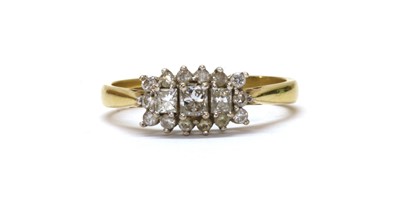 Lot 1179 - An 18ct gold three stone diamond cluster ring