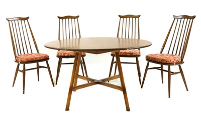 Lot 198 - An Ercol 'Windsor' dining table and four 'Goldsmith' chairs