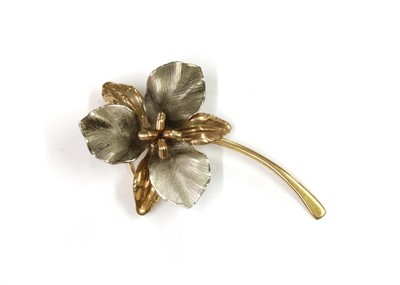Lot 1056 - A 9ct yellow and white gold flower brooch, by Ecco