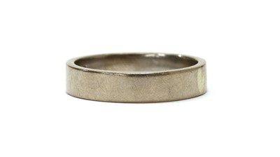 Lot 1077 - A white gold flat section wedding ring