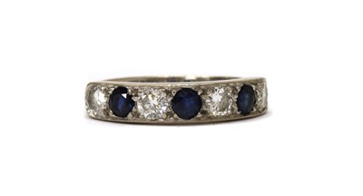 Lot 1284 - An 18ct white gold sapphire and diamond half eternity ring