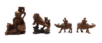 Lot 119 - Four Chinese wood carvings