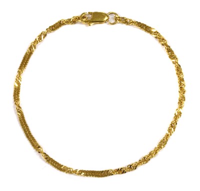 Lot 1119 - A 22ct gold twisted curb link bracelet