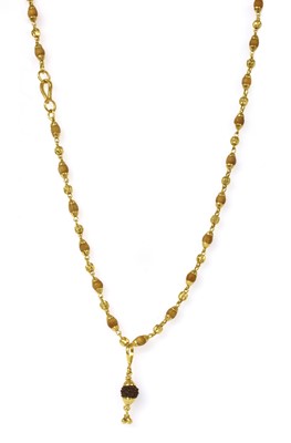 Lot 1150 - An Indian high carat gold Rudrasksh pendant