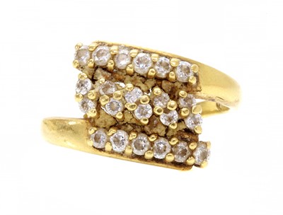 Lot 1163 - An Indian high carat gold cubic zirconia crossover ring