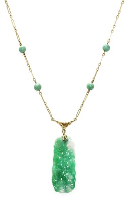 Lot 185 - An American carved jade plaque necklace, c.1925