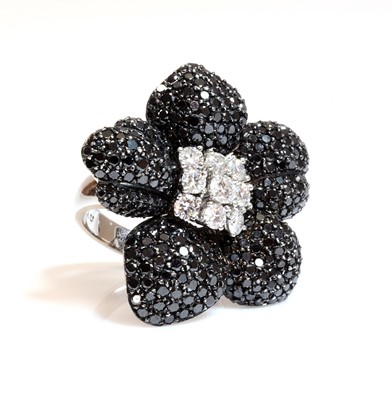 Lot 375 - A Continental white and black diamond orchid ring, c.1990