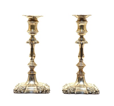 Lot 64 - A pair of Queen Anne style candlesticks by Ellis & Co