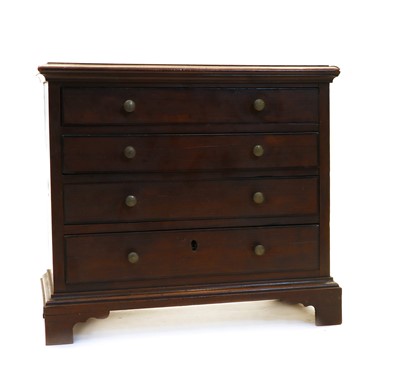 Lot 102 - A small yew wood chest of four drawers