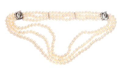 Lot 221 - A three row cultured pearl necklace and bracelet suite