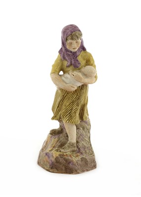 Lot 286 - A pottery figure of a girl holding a baby