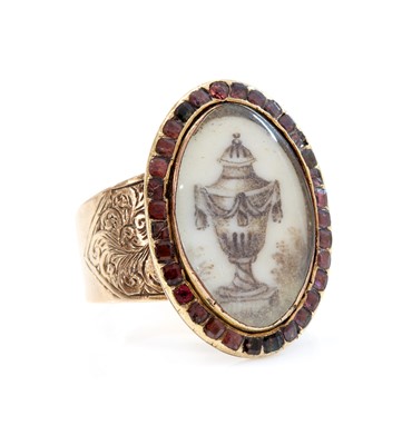 Lot 15 - A Georgian garnet set memorial ring
