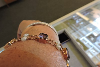 Lot 70 - A rose gold amethyst and pearl bracelet, c.1910
