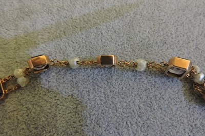 Lot 70 - A rose gold amethyst and pearl bracelet, c.1910