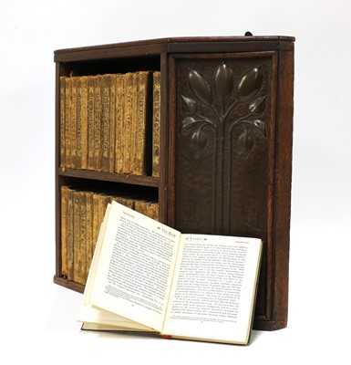 Lot 79 - An Arts and Crafts oak hanging bookshelf