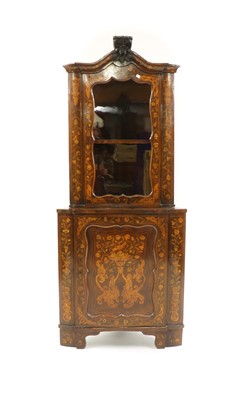 Lot 224 - A Dutch baroque style corner cupboard