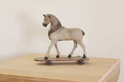 Lot 177 - A folk art pull-along horse