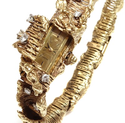 Lot 242 - A ladies' 18ct gold diamond set Omega mechanical cocktail bracelet watch, c.1970