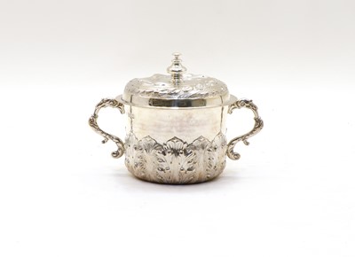 Lot 50 - A Charles II style Britannia silver porringer and cover