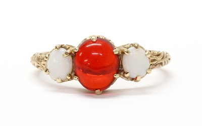 Lot 1299 - A 9ct gold three stone opal ring, by E W Adams