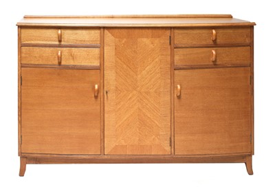 Lot 153 - A Cotswold School oak bow-front sideboard