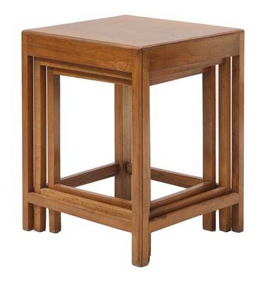 Lot 100 - A Cotswold School walnut nest of three tables