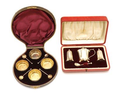 Lot 13 - A cased set of four silver table salts