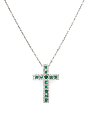 Lot 342 - An 18ct white gold emerald and diamond Latin style cross