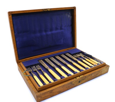 Lot 3 - An oak cased set of eight fish knives and forks