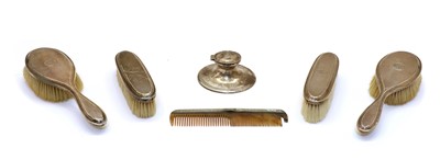 Lot 59 - An Edwardian silver capstan inkwell
