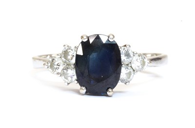 Lot 1283 - A white gold sapphire and diamond ring
