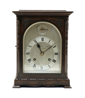Lot 159 - An oak mantel clock