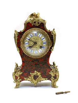 Lot 185 - A French red boulle and ebonised mantel clock
