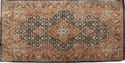 Lot 351 - A small Chinese silk rug