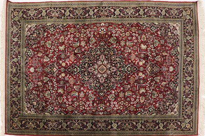 Lot 392 - A Persian silk rug