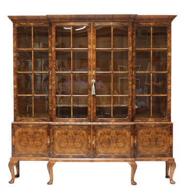 Lot 362 - A Queen Anne style burr walnut breakfront bookcase
