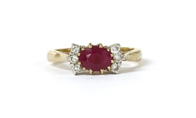 Lot 1218 - A 9ct gold ruby and diamond ring