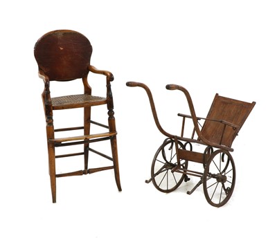 Lot 258 - An early 20th century fruitwood highchair