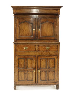 Lot 280 - An 18th century oak court cupboard