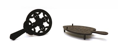 Lot 84 - Two cast iron trivets