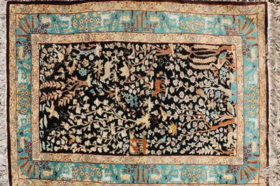 Lot 390 - A hand knotted Persian Tabriz design rug