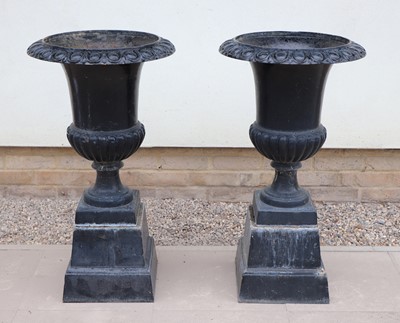 Lot 482 - A pair of cast iron black painted campana form garden urns