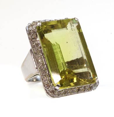 Lot 437 - A Continental citrine and diamond cluster ring