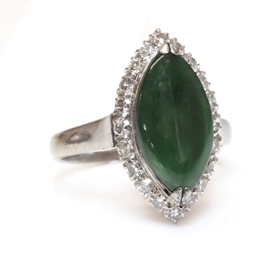 Lot 243 - A nephrite jade and diamond marquise shaped cluster ring