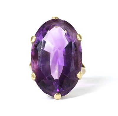 Lot 1250 - A gold single stone amethyst ring