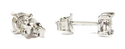 Lot 41 - A pair of white gold single stone diamond stud earrings