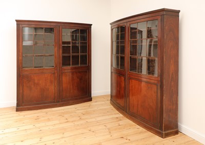 Lot 19 - A pair of mahogany bow front bookcases