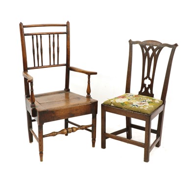 Lot 332 - An elm commode armchair